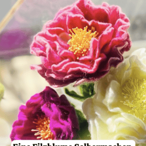 Bunte Filzblume mit gelben Staubblättern, handgefertigt, kreative Dekoration.
